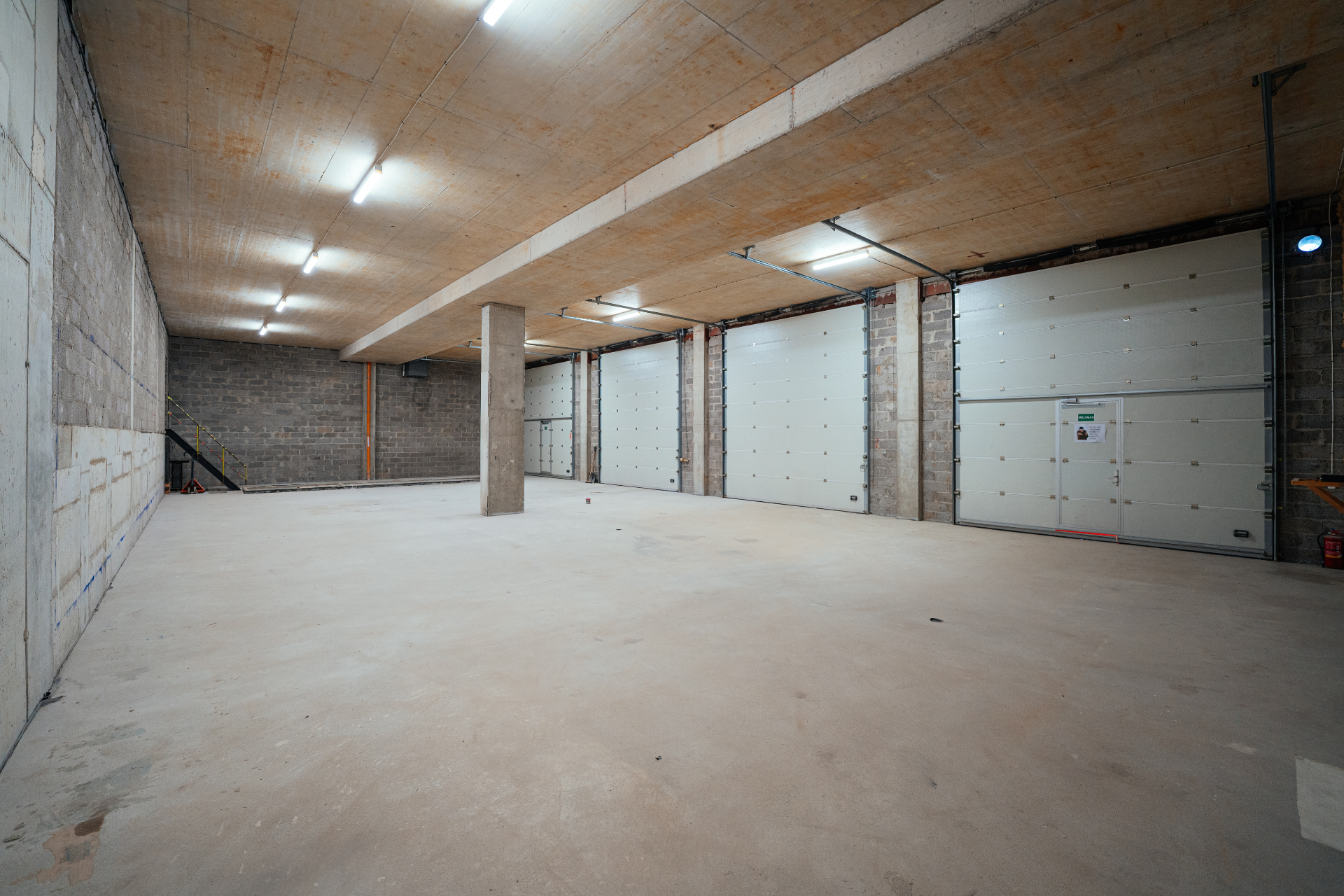 Covered garage with multiple large access doors